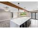 Eat-in kitchen with large island and open concept to living room at 1236 E Mclellan Blvd, Phoenix, AZ 85014