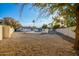 Landscaped backyard with gravel and a view of the house and pool at 1236 E Mclellan Blvd, Phoenix, AZ 85014