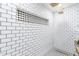 Clean shower with white subway tiles and a black and white geometric accent at 1236 E Mclellan Blvd, Phoenix, AZ 85014