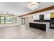 Open concept living area with modern kitchen and access to backyard at 1236 E Mclellan Blvd, Phoenix, AZ 85014