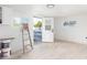 Bright, spacious interior room with white walls and wood-look tile floors at 1236 E Mclellan Blvd, Phoenix, AZ 85014