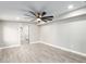 Spacious bedroom with ceiling fan and access to bathroom at 1236 E Mclellan Blvd, Phoenix, AZ 85014