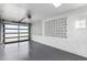 Attached garage with an automatic door and white block walls at 1236 E Mclellan Blvd, Phoenix, AZ 85014