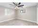 Well-lit bedroom featuring built-in shelving and ceiling fan at 1236 E Mclellan Blvd, Phoenix, AZ 85014