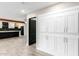 Bright hallway with built-in white cabinets and wood flooring at 1236 E Mclellan Blvd, Phoenix, AZ 85014