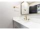 Modern bathroom with white vanity, gold fixtures, and large mirror at 1236 E Mclellan Blvd, Phoenix, AZ 85014