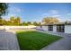 Large backyard with a pool, artificial turf, and patio at 1236 E Mclellan Blvd, Phoenix, AZ 85014