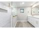 Modern bathroom with double vanity, gold fixtures, and a large walk-in shower at 1236 E Mclellan Blvd, Phoenix, AZ 85014