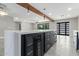 Modern kitchen island with white marble top and built-in wine cooler at 1236 E Mclellan Blvd, Phoenix, AZ 85014