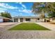 Mid-century modern home with artificial turf and updated landscaping at 1236 E Mclellan Blvd, Phoenix, AZ 85014