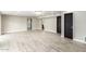 Bright and airy living area with wood-look tile floors and dark doors at 1236 E Mclellan Blvd, Phoenix, AZ 85014
