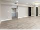 Spacious living room featuring light wood-look tile flooring and a marble-top island at 1236 E Mclellan Blvd, Phoenix, AZ 85014