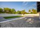 Landscaped backyard, featuring artificial turf and a patio area at 1236 E Mclellan Blvd, Phoenix, AZ 85014