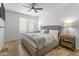 Spacious bedroom with a king-size bed and large window at 6900 E Princess Dr # 2221, Phoenix, AZ 85054
