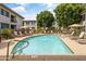 Inviting community pool with plenty of lounge chairs at 6900 E Princess Dr # 2221, Phoenix, AZ 85054