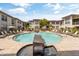 Refreshing community pool area with a water feature at 6900 E Princess Dr # 2221, Phoenix, AZ 85054