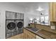 Convenient laundry room with stackable washer and dryer at 6900 E Princess Dr # 2221, Phoenix, AZ 85054