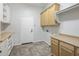 Bright laundry room with built-in cabinets and countertop at 3051 W Sousa Ct, Anthem, AZ 85086