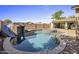 Resort-style backyard oasis with pool, spa, and waterslide at 3051 W Sousa Ct, Anthem, AZ 85086