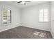 Bright bedroom with neutral walls, carpet flooring, and plantation shutters at 3051 W Sousa Ct, Anthem, AZ 85086