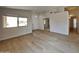 Bright living room with vinyl plank flooring and neutral color palette at 30629 N Royal Oak Way, San Tan Valley, AZ 85143
