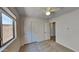 Bright bedroom with double door closet and ceiling fan at 30629 N Royal Oak Way, San Tan Valley, AZ 85143