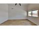 Spacious bedroom with large window, ceiling fan, and light flooring at 30629 N Royal Oak Way, San Tan Valley, AZ 85143