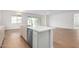 Kitchen island with seating space and stainless steel sink at 25226 N 131St Dr, Peoria, AZ 85383