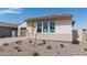 Modern home exterior with two-car garage and neutral colors at 25226 N 131St Dr, Peoria, AZ 85383