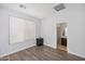 Light-filled bedroom with laminate floors and private bathroom at 2939 W Plum Hollow Dr, Anthem, AZ 85086