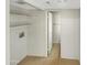 Laundry area with built-in shelving and access to a bathroom at 2617 W Willow Ave, Phoenix, AZ 85029