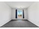 Bright bedroom featuring grey carpet and large window at 2425 W Bronco Butte Trl # 2017, Phoenix, AZ 85085