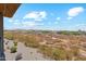 View of desert landscape and distant homes from a patio at 2425 W Bronco Butte Trl # 2017, Phoenix, AZ 85085