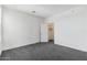 Bedroom with grey carpet and access to closet at 2425 W Bronco Butte Trl # 2017, Phoenix, AZ 85085