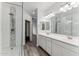 Modern bathroom with double sinks, large mirror, and walk-in shower at 2425 W Bronco Butte Trl # 2017, Phoenix, AZ 85085