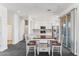 Bright kitchen with white cabinets, stainless steel appliances, and a table at 2425 W Bronco Butte Trl # 2017, Phoenix, AZ 85085