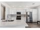 Modern kitchen with stainless steel appliances and white cabinets at 2425 W Bronco Butte Trl # 2017, Phoenix, AZ 85085