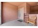 Inviting front patio with a small chair and shelf at 2425 W Bronco Butte Trl # 2017, Phoenix, AZ 85085
