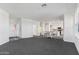 Open living area with gray carpet and views into the kitchen at 2425 W Bronco Butte Trl # 2017, Phoenix, AZ 85085