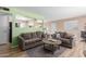 Living room with brown sofas and a view to the kitchen at 5323 E Covina Rd, Mesa, AZ 85205