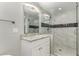 Bathroom with walk-in shower and granite vanity at 8672 E Edgemont Ave, Scottsdale, AZ 85257