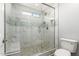 Large walk-in shower with pebble floor and glass enclosure at 2438 W Hearn Rd, Phoenix, AZ 85023