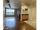 Open living area with polished concrete floors and partial kitchen view at 1701 E Colter St # 141, Phoenix, AZ 85016