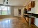 Modern kitchen with wood cabinets, stainless steel appliances, and granite countertop at 1701 E Colter St # 141, Phoenix, AZ 85016