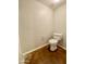 Simple bathroom with a toilet and neutral colored walls at 1701 E Colter St # 141, Phoenix, AZ 85016