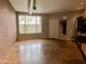 Open living area with exposed brick wall, polished concrete floors, and large window at 1701 E Colter St # 141, Phoenix, AZ 85016