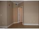 A short hallway with neutral-toned walls and tile flooring at 1701 E Colter St # 291, Phoenix, AZ 85016