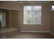 Bedroom with mirrored closet doors and tile flooring at 1701 E Colter St # 291, Phoenix, AZ 85016