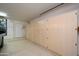 Garage with built-in storage cabinets and extra space at 18000 N Estrella Vista Dr, Surprise, AZ 85374