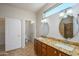 Main bathroom with granite double vanity and large mirrors at 18000 N Estrella Vista Dr, Surprise, AZ 85374